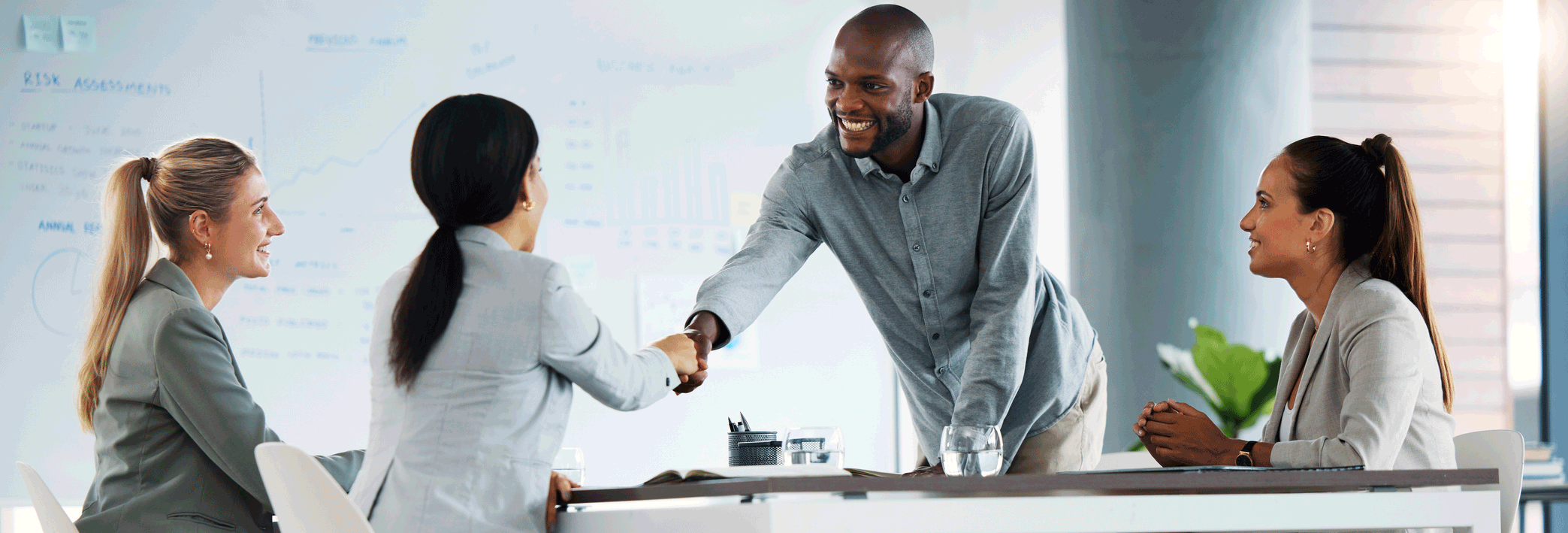 a hr manager seen congrajulating a candidate after an interview